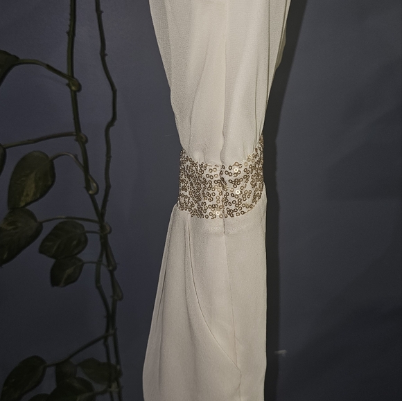 3/20.00. Classy white romper with sequins. - Picture 9 of 10